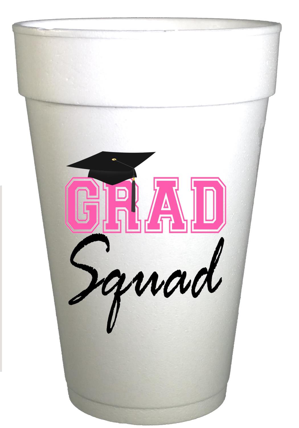 Styrofoam cups with black graduation cap and hot pink writing